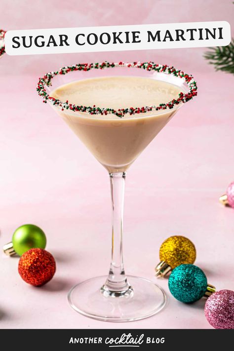 Just like your favorite Christmas cookie, this sugar cookie martini is sweet and festive. Made with whipped cream vodka, Irish cream, and a hint of amaretto, it's the perfect way to celebrate the holidays. Cookies And Cream Martini, Cookie Butter Martini, Sugar Cookie Espresso Martini, Christmas Cookie Martini, Sugar Cookie Cocktail, Cookie Martini Recipe, Sweet Martini Recipes, Sugar Cookie Martini Recipe, Sugar Cookie Martini