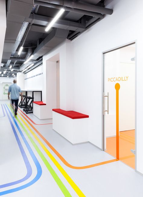 Kiev-based architect Emil Derish draw inspiration from the London Underground to design the interior of this language school in Kiev downtown. Floor Graphics, Kindergarten Design, Wayfinding Design, Wayfinding System, Hospital Interior, School Interior, Office Entrance, Hospital Design, Healthcare Design