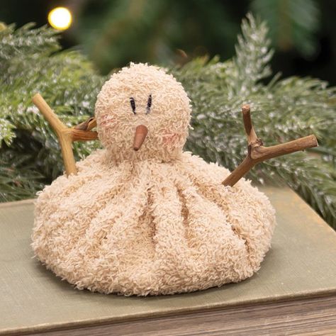 Our Baby Melting Snowman is made of textured fabric that is filled for a beanbag-style effect. This short, slouchy snowman has a wooden nose, rustic twig arms, and rosy cheeks. Perfect for adding a playful touch to a tabletop display of Winter decor. Measures 4" tall and 4" in diameter. Primitive Christmas Crafts, Snowman Baby, Melting Snowman, Tabletop Shelf, Melting Snowmen, Wood Snowman, Natural Christmas Decor, Primitive Snowmen, Rosy Cheeks