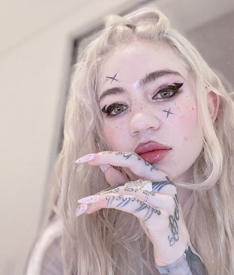 Grimes has tattooed ‘painful, beautiful alien scars’ across her whole back | Dazed Beauty Grimes Instagram, Grimes Tattoo, Grime Tattoo, Ethereal Goddess, White Ink Tattoo, Face Tattoos, June Birthstone Jewelry, Fine Art Jewelry, Aesthetic Tattoo