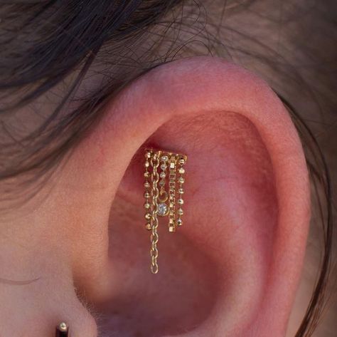 ✨Madeline Claustro✨ on Instagram: "Had the pleasure of adorning this faux rook with the “Bada Boom” from @pupil.hall . I absolutely love how chain pieces drape in areas like these! . Book with the link in my bio to have me style your ears sometime soon ✨ . #pupilhall #yellowgold #luxury #highqualityjewelry #handmade #curatedears #genuinediamonds #piercing #fauxrook #irispiercing #appmember #safepiercing #piercerofcolor #chicago #chicagopiercing" Pupil Hall, Ear Styling, Ear Style, Piercing Ideas, Ear Piercing, High Quality Jewelry, Piercing Jewelry, Earings Piercings, Ear Piercings