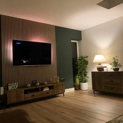 Moody Paneling, Wood Panels Living Room Wall, Green Tv Feature Wall, Slat Feature Wall Living Room, Wood Panelling Walls Living Room Tv, Slat Wall Living Room Tv, Panelled Walls Small Living Room, Lounge Wood Panelling, Dark Green Tv Wall