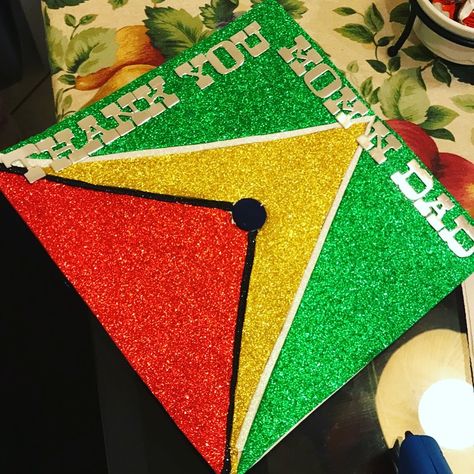 Guyana Flag grad cap  Made this cap for my 2017 graduation Guyanese Graduation Cap, Guyana Aesthetic, Flag Graduation Cap, Guyana Flag, Graduation Pic Ideas, Graduation Pic, Grad Cap Designs, Grad Caps, Cap Decoration