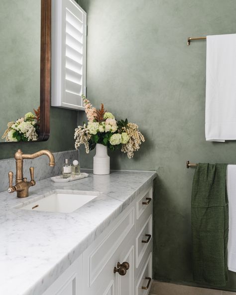 Green limewash paint, rich tiles, and striking acid washed tapware come together to create an organic atmosphere, enhancing daily routines, turning them into moments of relaxation and self-care. 📷: @hannahpuechmarin #TimelessInteriors #DesignInspiration #BathroomDesign #LuxuryLiving Lime Washed Bathroom, Bathroom Limewash, Green Limewash Paint, Green Limewash, Limewash Paint, Primary Bathroom, Timeless Interiors, Bathroom Color, Bathroom Inspo