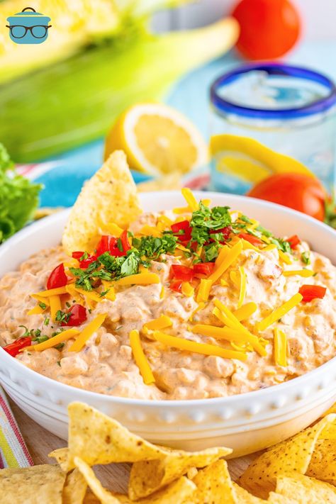 A bowl of Creamy Taco Dip. Creamy Taco Dip, White Pizza Dip, Cream Cheese Taco Dip, Crock Pot Queso, Refried Bean Dip, Mild Taco Seasoning, Cream Cheese Recipes Dip, Cheese Taco, Cheese Tacos