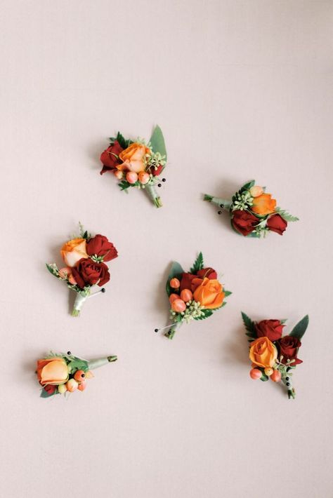 These simple fall boutonnieres made for the perfect pop of color on the groomsmen's suits in a variety of hues of orange and red with Peach Hypericum Berries. | Photograph by California wedding photographer Sarah Block Photography Fall Boutonniere, Block Photography, Mission Wedding, Fall Boutonnieres, Santa Barbara Mission, Cocktail Hour Wedding, Groomsmen Boutonniere, Groom Boutonniere, Santa Barbara Wedding