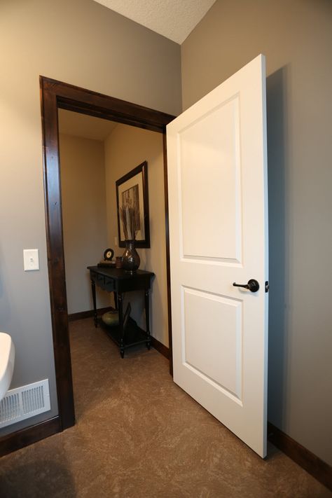 Interior Doors | 2 panel white molded door with dark casing and base trim | Bayer Built Woodworks Paint Doors Interior, Interior Doors Stained, Dark Wood Trim, Wood Door Frame, Stained Trim, Dark Trim, Brown Doors, Palette Design, Door Interior