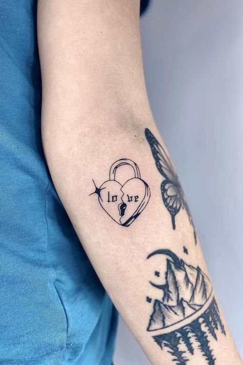 Bad At Love Tattoo, Unique Heart Tattoo Designs, Tattoos For Brokenhearted, Love Lock Tattoo, Edgy Heart Tattoo, Heart Themed Tattoos, Protect Your Heart Tattoo, Melting Heart Tattoo, Locked Heart Tattoo