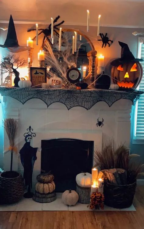 50+ Haunting Halloween Mantle Decor Ideas for a Spooky Yet Fun Vibe - HubPages Floating Candles Mantle, Witch Themed Mantel, Candles In Fireplace Halloween, Witch Themed Decor, Vintage Halloween Mantle, Floating Witch Hats And Candles, Fireplace Mantle Halloween Decor, Witch Hat Halloween Decor, Halloween Fireplace Ideas