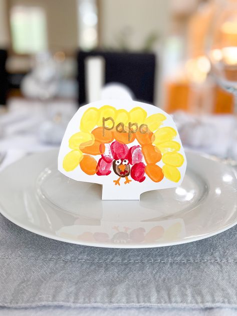 DIY Thanksgiving Table Place Cards Made by the Kiddos - Making Things is Awesome Thanksgiving Turkey Place Cards, Diy Place Settings Thanksgiving, Name Cards Thanksgiving Diy, Thanksgiving Name Place Cards For Kids To Make, Thanksgiving Table Name Cards Diy, Thanksgiving Name Place Cards Diy Kids Easy, Thanksgiving Placecards Ideas For Kids, Thanksgiving Card Crafts For Kids, Thanksgiving Diy Place Cards