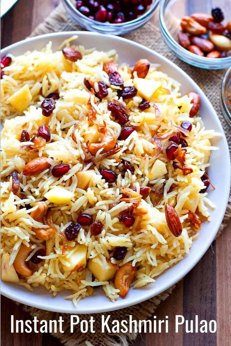 Learn how to make Kashmiri pulao, a superb rice recipe from Northern India that you will love. Long grain Basmati rice is cooked in ghee, spices, saffron, and milk and mixed with fried onions, dried and fresh fruit. Serve this veg pulao solo or as a side with other dishes. Made in the instant pot for ease of cooking. Kids Friendly Recipes, Kashmiri Pulao, Healthy Recipes Kids, South Indian Vegetarian Recipes, Vegetarian Rice Recipes, Indian Pudding, Veg Pulao, Indian Vegetarian Recipes, Lemon Rice