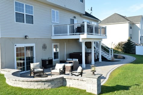 Backyard Patio Off Deck, 2 Story Outdoor Living Space, Under Deck Fire Pit, 2 Story Backyard Deck Ideas, Concrete Patio Under Deck Ideas, Patio Below Deck Ideas, Lifted Patio Deck, Patio At Bottom Of Deck Stairs, Two Story Deck Walkout Basement