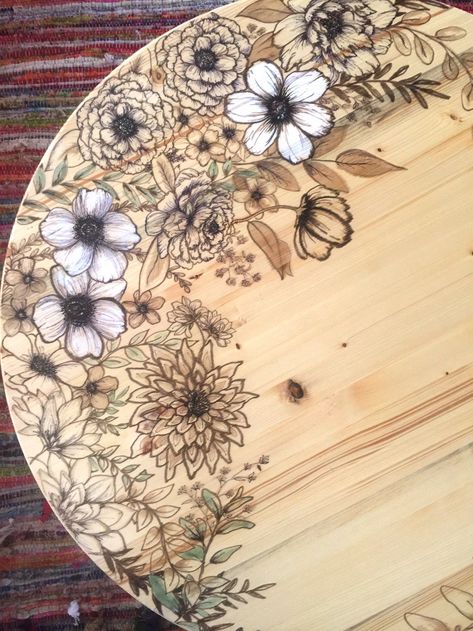 When you want to add a little floral personality to your coffee table or furniture piece, grab stain markers and draw some flowers. Our DIY shows you how. Pyrography Furniture, Wood Stain Art, Burnt Coffee Table, Marker Flowers, Wizard Room, Collage Furniture, Painted Picnic Tables, Stain Art, Rolling Island