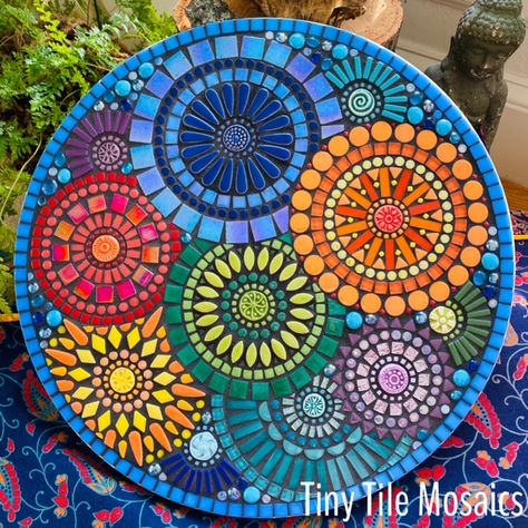 Title: Mosaic MandalasMedium:    wood substrate & ceramic, glass, mirror tiles (size: 18' circle)Artist Info: Name: Crystal D'AbbraccioArtist Contact: crystal@tinytilemosaics.comArtist Website: www.tinytilemosaics.comArtist Bio</ Mozaik Table, Stepping Stones Garden, Mosaic Circles, Mosaic Studio, Glass Mirror Tiles, Diverse Learners, Mosaic Tile Table, Mosaic Mural, Mosaic Tables