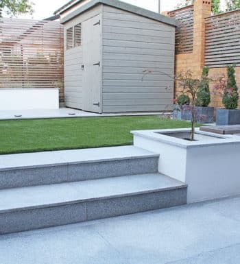 Porcelain Vs Natural Stone Patio Paving | Which Is Best? | Nustone Bullnose Steps, Silver Grey Granite, Sims Family, Modern Playhouse, Patio Paving, Patio Kits, Granite Paving, Sitting Areas, Patio Steps