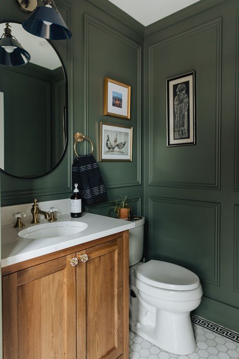 | Curio Design Studio Dark Green Bathroom White Tiles, Half Green Wall Bathroom, Half Bath Color Drench, Hunter Green Accent Wall Bathroom, Forest Green Powder Room, Chairrail Wainscoting Bathroom, Small Bathroom Blue Walls, Hunter Green Powder Room, Dark Green Bathroom Paint