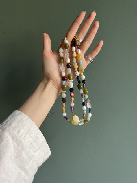 The 'Sophie' necklace features over 10 natural stones, each uniquely chosen to create a stunning, harmonious design. This handmade piece adds a touch of nature's elegance to any outfit, making it a perfect statement of individuality. #HandmadeJewelry #NaturalStoneJewelry #UniqueJewelry #BohoJewelry #StatementNecklace #ArtisanJewelry #EtsyFinds #MinimalistJewelry Bead Necklace Outfit, Necklace Outfit Ideas, Pearl Necklace Outfit, Beaded Necklace Outfit, Necklaces Bead, Jewelry Mood Board, Czech Jewelry, Natural Necklace, Necklace Outfit