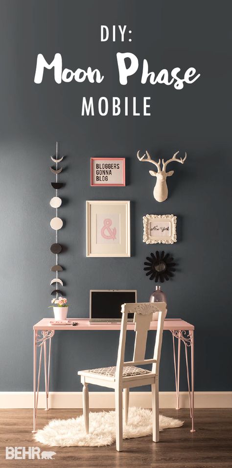 Add some dreamy wall art to your home office and revamp your desk with a gallery wall featuring this DIY Moon Phase Mobile. The cool gray shades paired with light pink accents are a perfect match. See how a fresh coat of gray paint can give you a new perspective and inspire your latest DIY projects. | Featured colors: Black Boudoir, Imperial Gray, Flint Gray, and Minimalistic Summer Storm Behr Paint, Behr Summer Storm, Nocturne Shade, Moon Mural, Diy Art Wall, Flamingo Feather, Color Spotlight, Diy Moon, Paint Wall Art