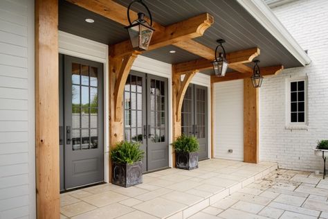 Gas lanterns add charm to this gorgeous entry way from Allard Ward Architects. Landscape House, Farmhouse Exterior Design, Casa Clean, Interior Design Minimalist, Kabinet Dapur, European Farmhouse, Farmhouse Front Porches, Modern Farmhouse Exterior, Farmhouse Front