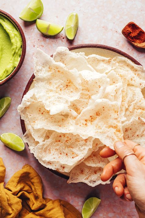 Fingers reaching in to grab a crispy rice paper chip from a plate Homemade Rice Paper, Rice Paper Chips, Crispy Rice Paper, Weekend Snacks, Snacks Vegan, Vegan Party Food, Vegan Party, Avocado Dip, Minimalist Baker