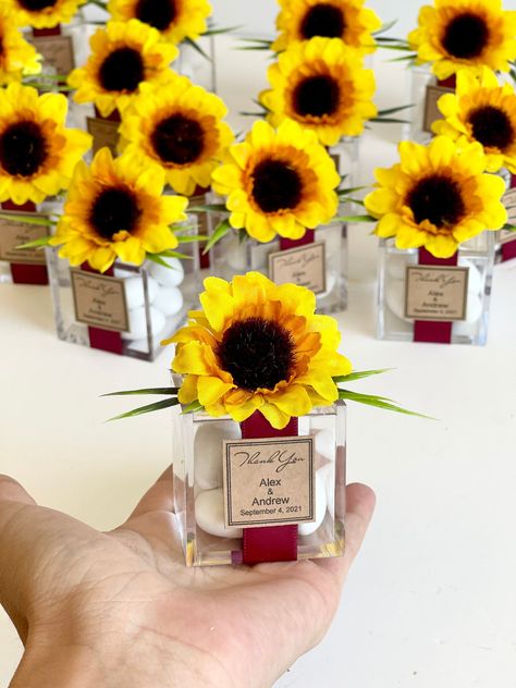 "5pcs Sunflower Favors, Wedding Favors, Favors, Favors Boxes, Wedding Favors for Guests, Rustic wedding, Party Favors, Custom Favors, Rustic DETAILS: - Quantity: 5 favors per pkg. - Materials:Plastic box,fake flower,paper tag, ribbon, candy - Favors are wrapped and packaged securely and safely for shipping. SIEZ: -1 3/4\"x1 3/4\"x1 3/4\" -4.5cm x 4.5cm x4.5cm TO ORDER - 2 NAMES - DATE of wedding - all of the personalization information - additional notes and any questions. For more my works you Sunflower Themed Party, Sunflower Party Favors, Yellow Wedding Favors, Sunflower Favors, Wedding Favors For Guests Rustic, Rustic Wedding Party Favors, Sunflower Wedding Favors, Lila Party, Sunflower Wedding Decorations