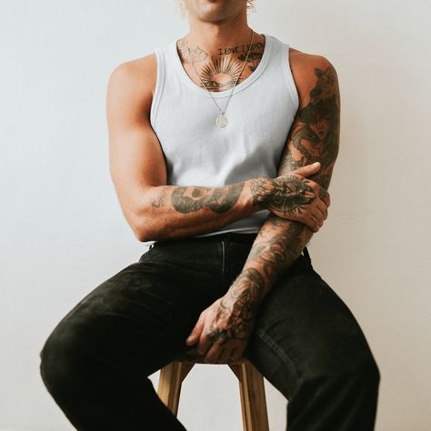 Handsome man in white tank top and black pants studio shot | premium image by rawpixel.com / Felix Male Model Standing, Wife Beater Tank Top, Wife Beater Tank, Boom Sauce, White Tank Jeans, Tattoo Male, Model Standing, Bday Shoot, Men Fashion Photoshoot