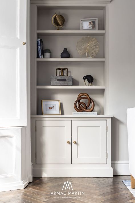 The open plan family space moves into a modern luxe living room. Echoing the same warm neutral palette with brass accents, the consistent use of hardware makes for a seamless and cohesive finish. Featuring our Cotswold Drawer Pull⁠ and Cotswold Ball Knob ⁠in burnished brass finish on perfectly styled living room shelves.