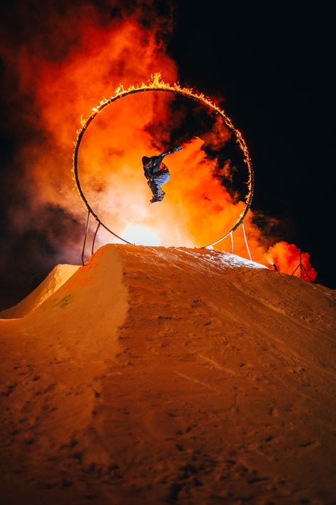 A snowboarder jumping through a ring of fire on the slopes. Dubai Desert Safari, Desert Safari Dubai, Motion Photography, Dubai Desert, Expo 2020, Ring Of Fire, Ruby Slippers, Go Crazy, Night Photos