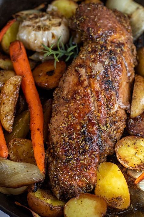 Easy honey mustard roasted pork tenderloin with potatoes and carrots is baked in the oven for a delicious family dinner. This oven baked pork tenderloin is flavorful, juicy and made in one pan! Juicy pork tenderloin with a honey mustard glaze gets oven roasted with perfectly seasoned potatoes and carrots.A complete family dinner ready in under in an hour and it gets baked in the same pan for easy clean up.I think pork is underrated.It can be overcooked so easily which makes it dry an… Pork Tenderloin Roast In Oven, Pork Half Loin Recipes, Pork Tenderloin Recipes In Dutch Oven, Juicy Pork Tenderloin Recipes In Oven, Baked Tenderloin Recipes, Think Pork Chop Recipes, Pork Tenderloin Recipes In Oven Easy, Pork Tenderloin Recipes Fall, Pork Roast Vegetables