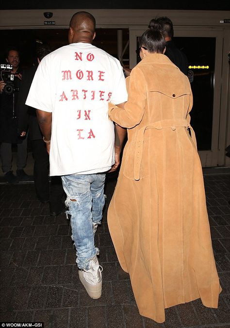 Attention-grabbing: The Life of Pablo artist wore a crew-neck sweatshirt with album track title No More Parties In LA emblazoned across the back, while his wife covered up her rear view in a floor-length coat Kanye West Photo, Life Of Pablo, Kim Kardashian And Kanye West, Kanye West Style, Kanye West And Kim, Kim And Kanye, Celebrity Style Icons, Kim Kardashian And Kanye, Kim Kardashian West