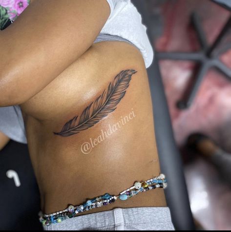 Feather Tattoo Ribs, Under Rib Tattoos For Women, Rib Tattoo Cover Up Ideas, Red Feather Tattoo, Feather Tattoo Black, Girl Rib Tattoos, Tattoo Spine, Rib Tattoos For Women, Waist Tattoos