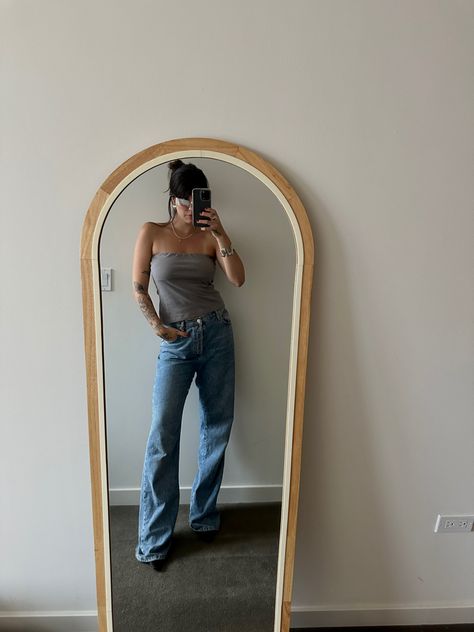 Woman wearing 90s inspired gray tube top, wide leg blue jeans Gray Tube Top Outfit, Grey Tube Top Outfit, Tube Outfit, Flowy Tube Top, Tube Top Outfit, Grey Tube Top, Tube Top Outfits, 90s Outfit, Top Outfit