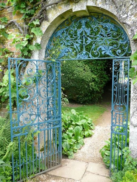 A glorious gate in the garden at Rousham, near Oxford. "The color used here is Prussian blue. Such a color is found occasionally on 18th century ironwork."  Paint Colors for Iron Gates and Fences Gardenista Garden Gates And Fencing, Garden Gate Design, Gates And Railings, Garden Entrance, Wrought Iron Gates, Iron Fence, Blue Garden, Iron Gates, Fence Gate