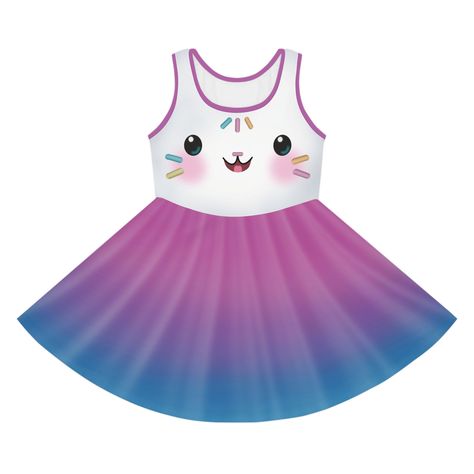 This "Cakey" dress is perfect for toddlers and girls Halloween costumes and dress up! The dress is illustrated with a Cakey Cat style face on top and sprinkles on the back. The skirt is printed with a pink, purple and blue cupcake wrapper design. If you prefer the costume without the face and just white frosting or sprinkles, please let me know. Fans of Gabby's Dollhouse can enjoy this dress for Halloween, birthdays, sprinkle parties and everyday dress up play! Made with 95% polyester and 5% spa Cakey Gabby Doll House Costume, Gabbys Dollhouse Cakey Cat Costume, Gabby’s Dollhouse Costume, Gabbys Dollhouse Birthday Party Tshirt, Gabby Dollhouse Shirt, Mercat Gabby's Dollhouse, Wrapper Design, Cupcake Rose, Princess Elsa Dress