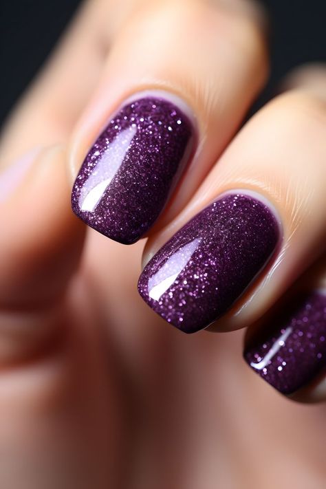 dark purple nails, glitter nail art, nail inspiration, nail design, nail ideas, nail trends, nail style, nail fashion, nail beauty, nail inspo, nail goals, nail perfection, nail magic, nail love, nail obsession, nail addiction, nail vibes, nail chic, nail elegance, nail glamour, nail sparkle, nail shine, nail statement, nail confidence Cadbury Purple Nails, Plum Glitter Nails, Dark Purple Sparkle Nails, Sparkle Purple Nails, Purple Nails Sparkle, Dark Purple Nails With Glitter, Dark Purple Halloween Nails, Dark Purple Glitter Nails, Purple Glittery Nails