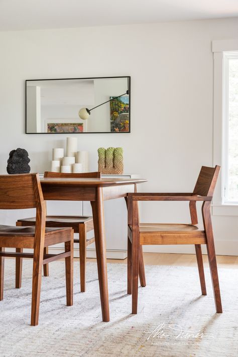 A walnut dining table and dining chairs are in a contemporary home with white walls and neutral rugs. New England Dining Room, Interior Design Inspiration, Furniture Making, New England, The Beauty, Patina, Dining Room, Design Inspiration, England