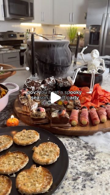 taelor rankin on Instagram: "good morning ghouls & goblins

It’s time for the best part of the year. Halloween is my absolute fav holiday and this year I’m giving you a peak into how I host my Halloween parties. This is party number 1 and this week I’ll be posting all the recipes you need to make this spread yourself 👻

Which recipe do you want to see first? 

#halloween #halloweenfood #halloweenfoodideas #spookyseason #halloweenparty #halloweenpartyideas #girlsnight #pumpkin #scary

Comment SPOOKY to receive a DM with the link to all the serve-ware featured in this vid!

 ⬇ https://liketk.it/4SGzj" Halloween Skull Appetizers, Sweet And Savory Halloween Charcuterie Board, S’mores Ghost Dip, Halloween S’mores Charcuterie, Jackolantern Charcuterie, Girls Night, Halloween Party, Halloween