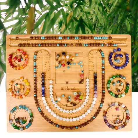 PRICES MAY VARY. Material：bamboo Size：15 X 11.4 X 0.4 inch Description：U grooves for necklaces from 17.3" to 30" length , 6 circular grooves are used for the bracelet design, ranging from 5.2" to 7.6" in circumference. 2 straight grooves, 13.75", in length All grooves are engraved with dimensions and scales And there are 8 storage grooves for bead. Delivery contents：1 sturdy bamboo beading board Shown beads and tools are not included Mind:bamboo is a natural product and is subject to fluctuation Beading Board, Senior Sunday, Jewelry Tray Organizer, Native Beading Patterns, Bracelet Design, Bracelets Handmade Beaded, Jewelry Design Necklace, Jewelry Bracelet, Crafts Sewing