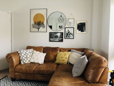 Above Couch Wall Decor With Mirror, Circle Mirror Gallery Wall Living Rooms, Round Mirror Picture Wall, Wall Collage With Round Mirror, Circle Gallery Wall, Circle Mirror Behind Couch, Mirror And Photo Gallery Wall, Circle Mirror Gallery Wall, Living Room Gallery Wall With Mirror