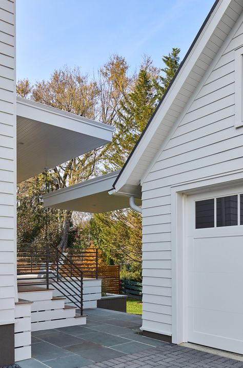 The cantilevers extend from the garage and rear structure of the house to provide shade and protection from the elements. The Garage, Outdoor Spaces, Architects, Garage, The House, Shades