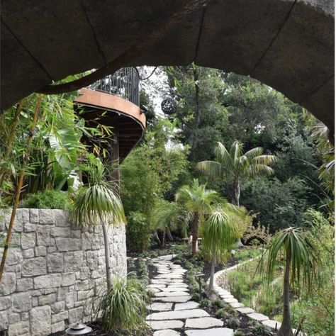 For this landscaping project, the goal was that we created a hidden paradise right in their backyard. We combined detailed stonework, lush tropical plants, and a custom pool with a cascading waterfall to make the space feel magical and inviting. With a winding stone path and towering rock features, there was something unique and beautiful at every turn for this specific design! Key Features and Details👇 ✔️ Enchanted Entryway: A grand stone archway adorned with climbing vines welcomes you ... Stone Archway, Cascading Waterfall, Custom Pool, Stone Path, Climbing Vines, Custom Pools, Landscape Projects, Tropical Plants, Enchanted