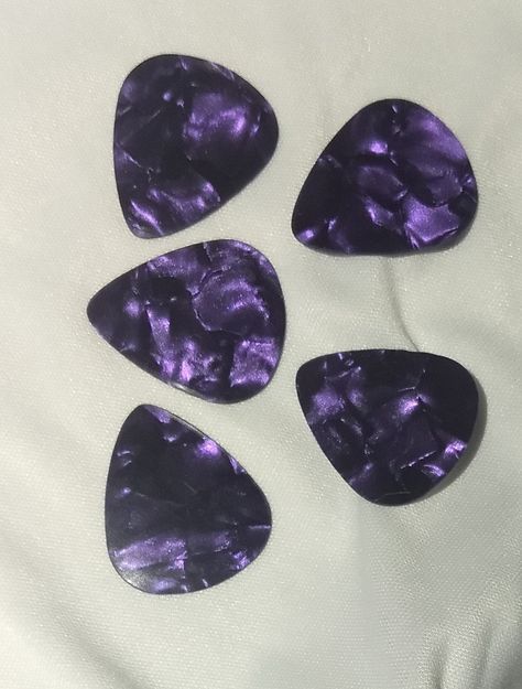 Guitar Players....picks, picks and more picks....!  Hand punched, these Purple Metallic Guitar Picks have a smooth finish and are light gauge, .48mm....  Sold 5 per pack.... Purple Electric Guitar Aesthetic, Guitar Pick Aesthetic, Purple Guitar Aesthetic, Purple Electric Guitar, Guitar Purple, Cool Guitar Picks, Guitar Pic, Purple Guitar, Luna Guitars