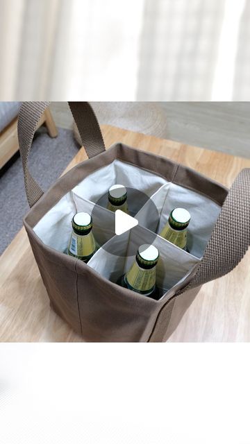 Ae PooiM on Instagram: "DIY Beer Carrier Tote Bag. Learn more: Watch full video version with measurement detail on my youtube channel “Ae PooiM” #sewingforbeginner #diybags #bagtutorial #sewingprojects #fabricbags #totebag #beercarrier" Beer Carrier, Diy Beer, Coffee Holder, Stitch Flowers, Instagram Diy, Bags Tutorial, Fabric Bags, Cross Stitch Flowers, Sewing Basics