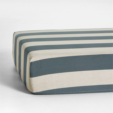 Give your nursery some vacay vibes with the bold, cabana-style stripes of our Riviera Crib Fitted Sheet. The organic cotton chambray with slate blue stripes offers a subtly textured, irresistibly soft feel that's still light and breathable. For a playful nursery look, pair the sheet with our matching changing pad cover.   • 100% organic cotton chambray, grown without chemicals or pesticides  • Passes OEKO-TEXr STANDARD 100 textile safety tests  • Elastic band keeps sheet in place  • This item ca Surf Nursery, Black Crib, Sports Nursery, Tree Interior, Crib Fitted Sheet, Crib Bedding Boy, Modern Crib, Boys Crib, Baby Sheets