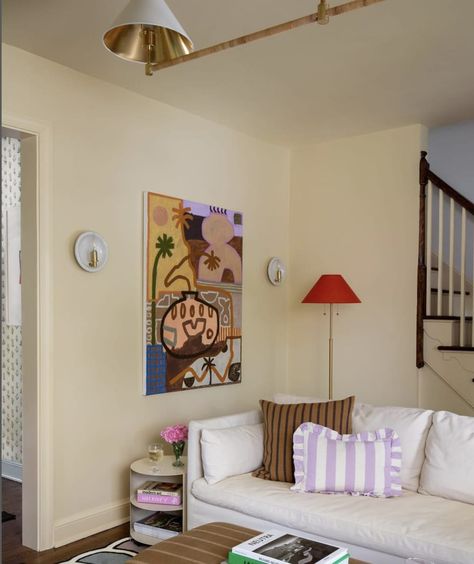 A butter yellow-drenched living room painted in Farrow’s Cream by Farrow & Ball. Butter Yellow Sofa, Cream Walls Interior Design, Yellow Cream Walls Living Room, Apricot Walls Living Room, Edinburgh Interior Design, Living Room Wall Color Yellow, Cream Walls Interior, Soft Yellow Living Room Walls, Light Yellow Paint Living Room