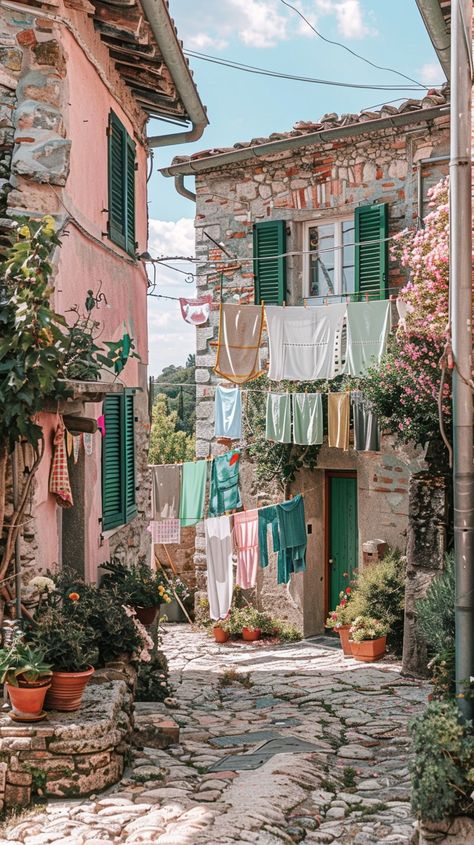 Quaint Village Lane: A charming narrow lane in a European village, adorned with hanging #clothesline and vibrant #flora. #EuropeanCharm #RusticBeauty #aiart #aiphoto #stockcake ⬇️ Download and 📝 Prompt 👉 https://stockcake.com/i/quaint-village-lane_1051907_891768 Cute Village, Colorful Village, Cottage Village, Hanging Laundry, Property Renovation, European Village, English Village, Dark Kitchen, Quaint Village