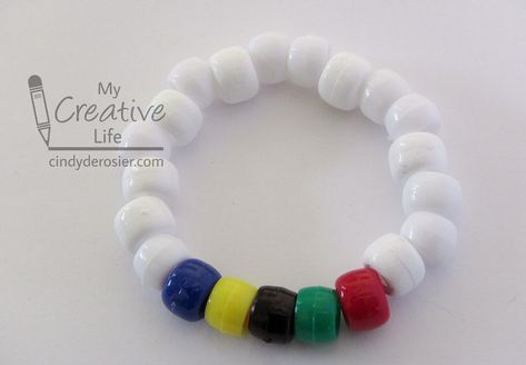 This easy pony bead bracelet is inspired by the Olympic flag. It’s a fun craft to do while watching the … Olympics Crafts For Kids, Olympic Activities For Kids, Olympic Vbs, Summer Olympics Crafts, Vbs Olympics, Appreciation Crafts, Olympic Activities, Gymnastics Camp, Olympic Idea