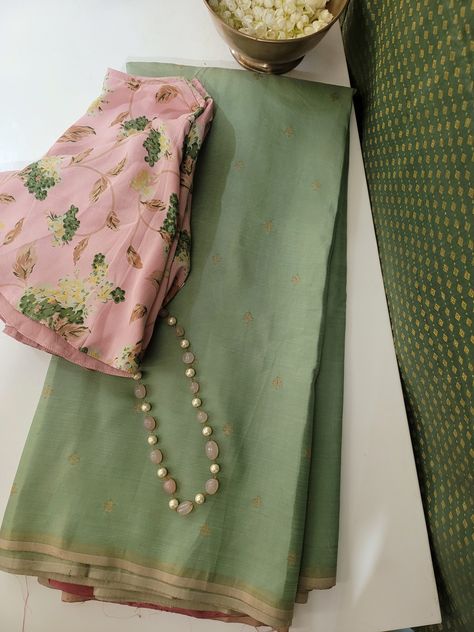 Cardamom green kancheepuram silk saree with zari buttis woven in pure zari on the body. The pallu and blouse is dusty pink with maple leaves printed all over. The saree is softened and drapes beautifully. Green Shade Saree, Contrast Colour For Pink, Saree And Blouse Color Combinations, Green Combination Color, Green And Pink Saree, Isha Borah, Saree Aesthetics, Normal Saree, Sarees Ideas