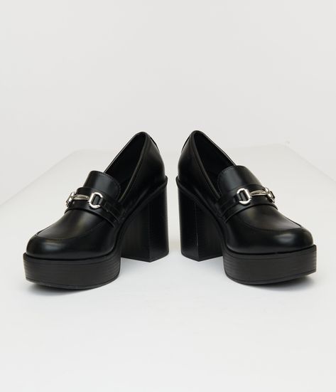 These chic beauties combine the classic flair of loafers with a stylish heel, making them perfect for both the office and after-hours outings. The soft leatherette material hugs your feet comfortably, while the sleek metal chain detail adds just the right touch of sophistication. With their versatile black hue, you can easily pair them with anything! Complete with a 4 inch heel..Available while supplies last. | Black Leatherette Loafer Heels | Size 8 Loafer Heels, Stylish Heels, Size 11 Heels, 4 Inch Heels, After Hours, Heeled Loafers, Metal Chain, Unique Vintage, The Office