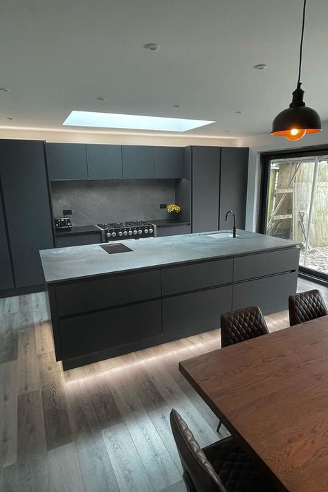 Dark grey kitchen, with grey LVT flooring and copper lights Grey Wooden Floor, Dark Grey Kitchen Cabinets, Bedroom 2023, Flat Kitchen, Direct Wood Flooring, Open Plan Kitchen Dining Living, Flooring Kitchen, Dark Grey Kitchen, Modern Kitchen Design Black